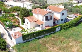 Three-storey villa with a lush garden, a parking and sea views in Peloponnese, Greece for 320,000 €