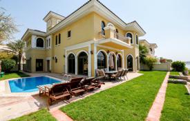 Modern villa with a terrace, a pool, sea views and a private beach, near the golf course, Palm Jumeirah, Dubai, UAE. Price on request