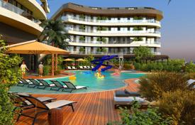 Luxury apartment with a private garden and a pool in a new residence with a tennis court and a gym, Alanya, Turkey for $293,000