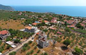Two stone unfinished houses overlooking the sea in Neochori, Peloponnese, Greece for 270,000 €