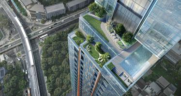 High-rise residential complex with loft apartments next to the metro, in the business district of Bangkok, Thailand