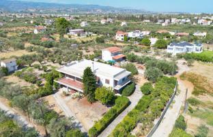 Well maintained two-storey house with a garden and a large plot in Corinthia, Greece for 320,000 €