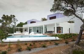 Modern furnished villa with a private garden, an open pool, a parking and spectacular sea views, Es Cubells, Spain for 22,000 € per week