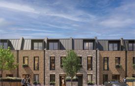 Townhouses with private small gardens in a new riverside residential complex, London, UK for From £1,173,000