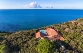 Elite villa with a terrace, sea views, a pool and direct access to the beach, bordering a nature reserve, Punta Ala, Italy. Price on request