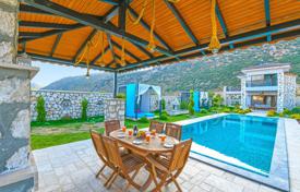 Furnished two-bedroom townhouse with indoor pool and sauna in the tranquil nature of Kalkan for $908,000