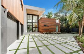 Modern villa with backyard, a pool, a summer kitchen, a sitting area, a terrace and two garages, Miami, USA for $4,795,000