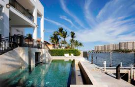 Three-storey modern villa with a swimming pool, a garage, a dock, a terrace and views of the bay, Miami, USA for $13,950,000