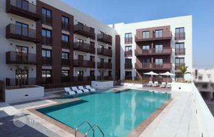 New apartments in a residence Eaton Place with a swimming pool and around-the-clock security, JVC area, Dubai, UAE. Price on request
