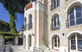 Houses with pools by the sea for sale in Côte d'Azur (French Riviera). Three-storey villa with a natural stone facade with a picturesque garden and a sea view, Eze, France Houses with pools by the sea for sale in Côte d'Azur (French Riviera). Three-storey villa with a natural stone facade with a picturesque garden and a sea view, Eze, France