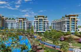 New spacious apartments in a large residence with a hotel, aquaparks and an amusement park, 300 meters from the sea, Alanya, Turkey for $210,000