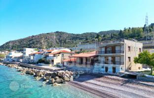 Two-storey house with a garden and a parking right on the seafront in Corinthia, Greece for 370,000 €