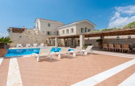 Spacious beachfront villa with a private beach, a dock, a tennis court and a pool in a posh neighbourhood, Elounda, Crete, Greece for 28,000 € per week