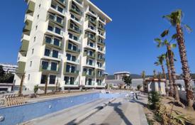 Upper-Floor One-Bedroom Apartment with Two Balconies and Mountain Views in Alanya for $165,000