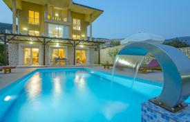 Luxury villa with a swimming pool and a panoramic sea view, 50 meters from the beach, Kalkan, Turkey for $9,000 per week