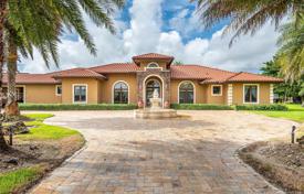 Spacious villa with a garden, a backyard, a pool, a barbecue area, a patio and a garage, Miami, USA for $2,300,000
