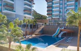 Furnished one-bedroom apartment in a residence with swimming pools and a tennis court, 400 meters from the sea, Kargıcak, Turkey for $153,000