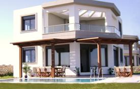Modern villa with a swimming pool, a garden and an access to the beach in a small residential complex, Kiotari, Greece for 2,730 € per week