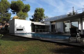 Three-storey villa with a view of the sea and a swimming pool in a pine forest, Tamarit, Spain. Price on request