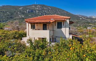 Two-storey house with a large plot just 400 m from the sea in Peloponnese, Greece for 300,000 €