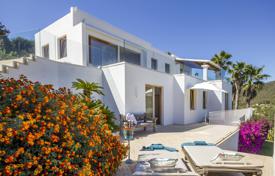 Modern furnished villa with a private pool, a garden and open terraces overlooking the sea, Ibiza, Spain. Price on request