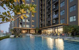 High-rise residence with a swimming pool and lounge areas in a posh neighborhood of Bangkok, Thailand for From $129,000