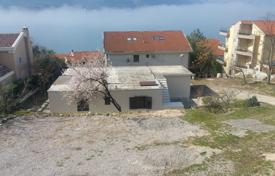 Building plot of 1,384 m² with house, garage, sea view, and construction potential up to 900 m² – Dobrota, Kotor for 840,000 €