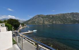 Comfortable duplex-apartment with a terrace and sea views in a modern residence, on the first line from the beach, Donji Stoliv, Montenegro for 260,000 €