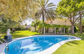 Modern villa with a swimming pool, a garden and a parking at 250 meters from the sandy beach, Sitges, Spain. Price on request