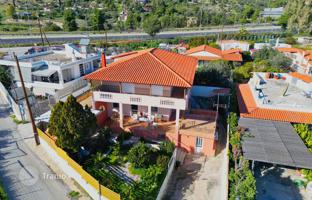 Two-storey house with a garden and a parking just 500 meters from the sea, Corinthia, Greece. Price on request