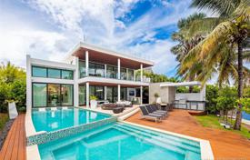 Modern villa with a backyard, a pool, a sitting area, a terrace and garages, Miami Beach, USA for $8,000,000