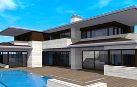 Three-storey villa with a swimming pool and an elevator in a residence with tennis courts, 150 meters from the sea, close to Barcelona for 3,500,000 €