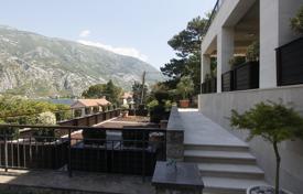 New house with a garage and a picturesque view at 35 meters from the sea, Muo, Montenegro for 1,750,000 €
