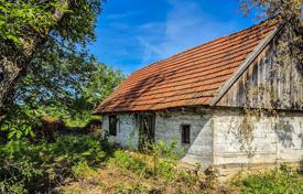 SLUNJ, TRŽIĆ- 77,083 m² of land with a house, investment opportunity for 62,000 €