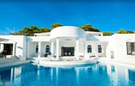 Snow white villa with a panoramic terrace and a swimming pool on the first line from the Cala Jondal beach, Ibiza, Spain for 57,000 € per week