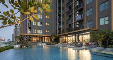 High-rise residence with a swimming pool and lounge areas in a posh neighborhood of Bangkok, Thailand