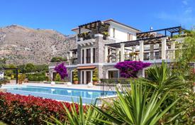Three-level villa with a pool, a wide range of services and a private beach in Elounda, Crete, Greece. Price on request