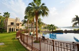 Spacious villa with a terrace, a pool, sea views and a private beach, near the golf course, Palm Jumeirah, Dubai, UAE. Price on request