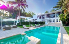 Tropical villa with a pool, a spa, a garage, a terrace, a garden and an ocean view, Miami Beach, USA for $12,950,000