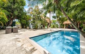 Comfortable villa with a backyard, a swimming pool, a summer kitchen, a seating area and a garage, Miami, USA for $1,490,000