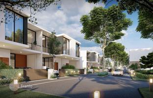 New two-storey townhouse with a swimming pool and a parking in Pattaya, Chonburi, Thailand for $135,000