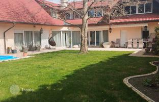 Spacious villa with a pool, a garden, a garage and a sauna in Budaors, Pest, Hungary for 990,000 €
