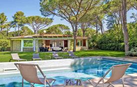 Spacious villa with a swimming pool and a jacuzzi in a gated residence with a pine park and a private beach, Roccamare, Italy. Price on request