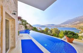 Four-storey villa with a swimming pool and a parking at 300 meters from the sea, Kalkan, Turkey. Price on request