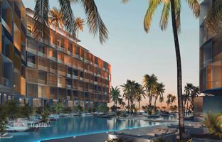 One-bedroom apartments in a condo hotel with swimming pools and a beach, surrounded by Arabian Gulf, The World Islands, Dubai, UAE for $477,000